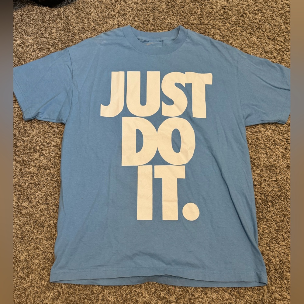 Nike Sky Blue Tee with Bold White Slogan